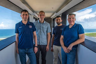 The four crew members that comprise the SpaceX Crew-6 mission pose for a photo during a training session on the crew access arm at NASA's Kennedy Space Center's Launch Pad 39A in Florida.