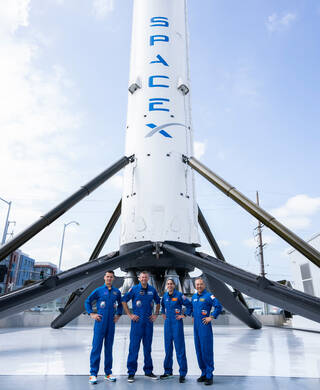NASA's SpaceX Crew-7 crew poses for a photo outside of SpaceX in Hawthorne, California during a trip to train for their International Space Station mission.