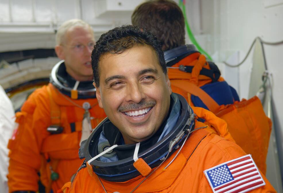 In the White Room on NASA Kennedy Space Center's Launch Pad 39A, STS-128 Mission Specialist Jose Hernandez waits his turn to enter space shuttle Discovery.