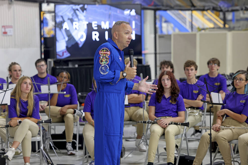 NASA astronaut Randy Bresnik speaks to members of the Hahnville High School Symphonic Band before their performance at Orions employee appreciation event Aug. 29 at Michoud Assembly Facility.