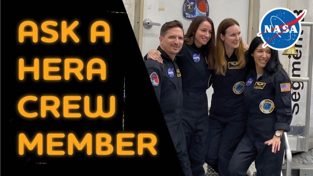 HERA mission crew members are photographed to the right of the image. Text on the left reads, "ask a HERA crew member," in bold yellow font.