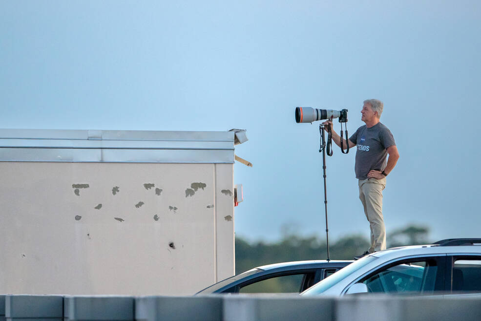 Michoud photographer Michael DeMocker waits on the roof of his car to capture a super blue moon image.
