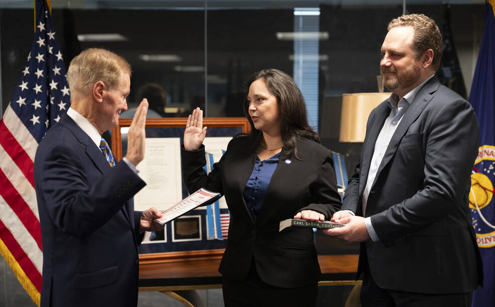 Charity Weeden, center, is sworn in as associate administrator for NASAs Office of Technology, Policy, and Strategy by NASA Administrator Bill Nelson, Sunday, Aug. 27, 2023, at the Mary W. Jackson NASA Headquarters building in Washington.