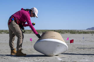 A recovery team member takes part in field rehearsals in preparation for the retrieval of the sample return capsule from NASA's OSIRIS-REx mission in this image from Aug. 29, 2023. 