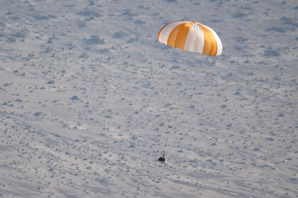 A training model of the sample return capsule is seen is seen during a drop test in preparation for the retrieval of the sample return capsule from NASA's OSIRIS-REx mission, Wednesday, Aug. 30, 2023.