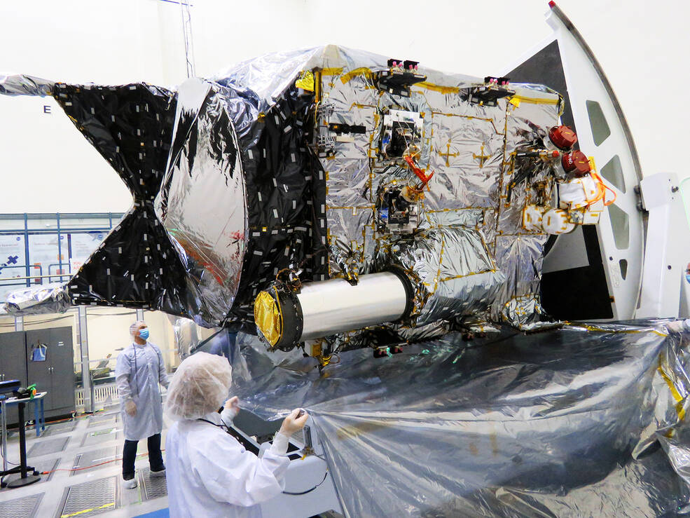 The flight transceiver for NASAs Deep Space Optical Communications demonstration can be identified by its large tube-like sunshade on the Psyche spacecraft, seen here inside a clean room at NASAs Jet Propulsion Laboratory in Southern California.