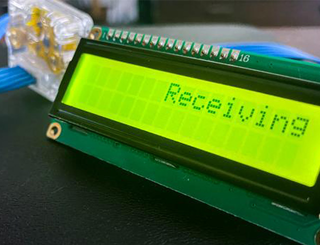 A green electronic screen that says "receiving."