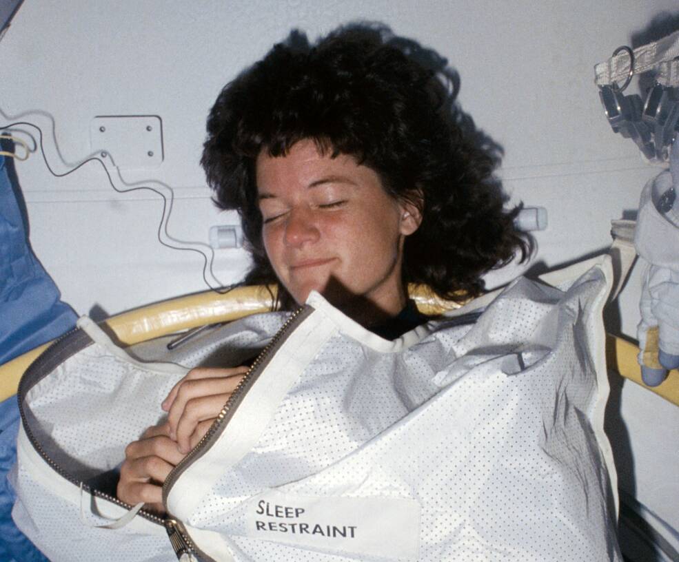 This image of NASA astronaut Sally K. Ride was captured at her sleep station in the Space Shuttle Challenger's middeck.