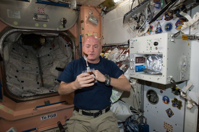 NASA astronaut Scott Kelly enjoys his first drink from ISSpresso machine on the International Space Station. The espresso device allows crews to make tea, coffee, broth, or other hot beverages they might enjoy.