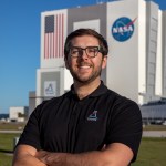 NASA Kennedy Space Center's Sean Arrieta is photographed in front of the Vehicle Assembly Building.