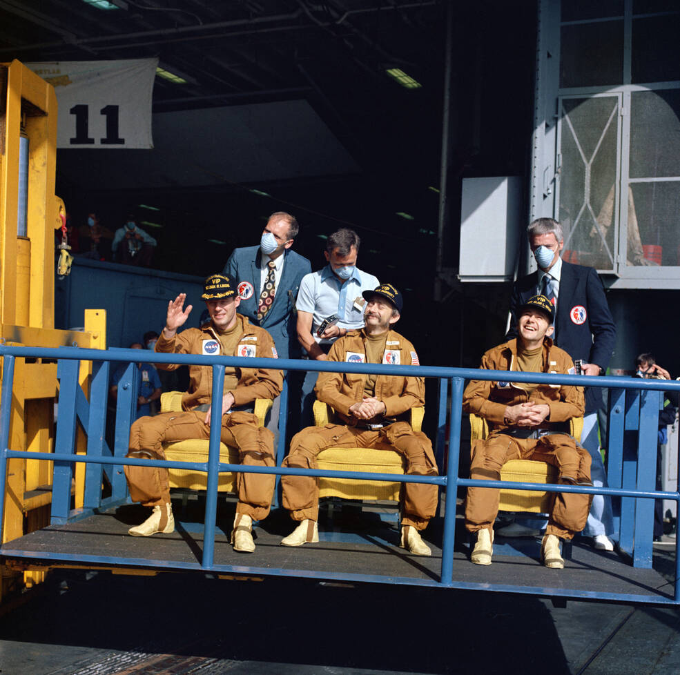 The Skylab 3 crew of Lousma, Owen K. Garriott, and Alan L. Bean on board the recovery ship USS New Orleans