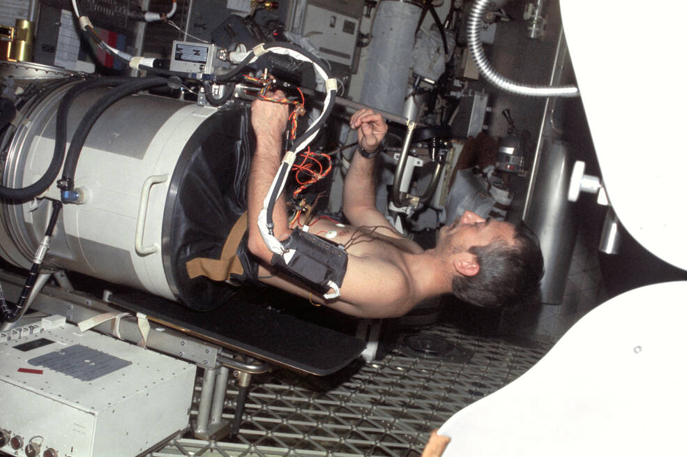 Skylab 3 astronaut Owen K. Garriott in the Lower Body Negative Pressure device 