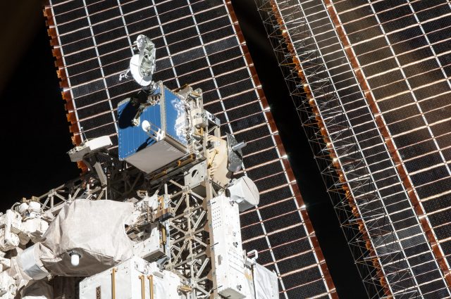 Image of the SCaN Testbed installed on the International Space Station. The space station's solar array can be seen in the background.