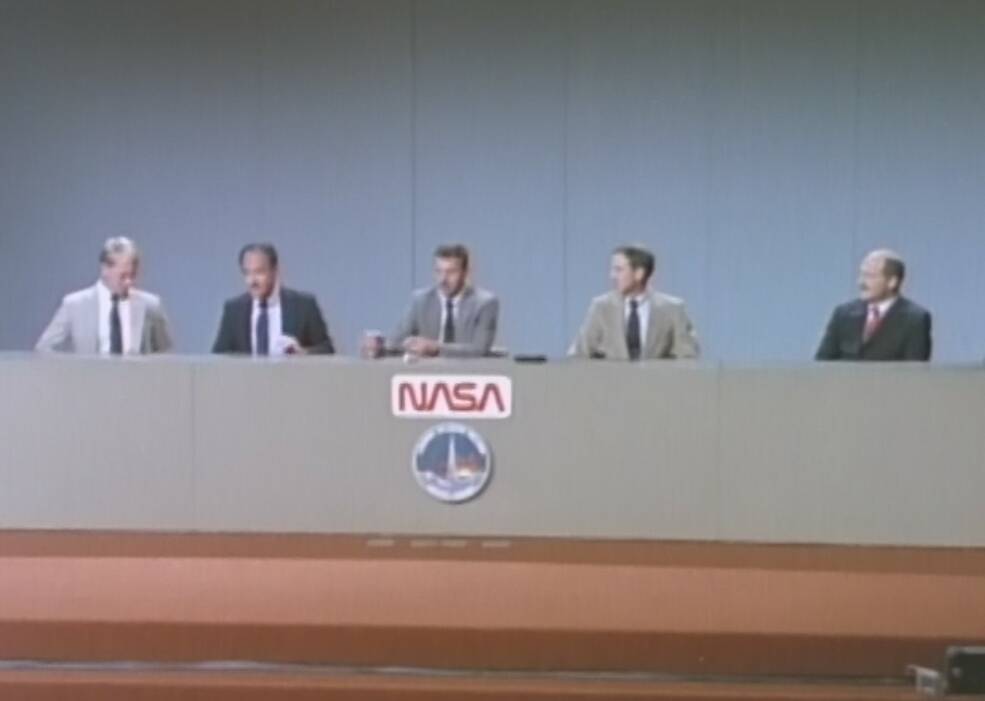 STS-26 astronauts George D. “Pinky” Nelson, left, John M. “Mike” Lounge, David C. Hilmers, Richard “Dick” O. Covey, and Fredrick “Rick” H. Hauck during the postflight press conference at JSC