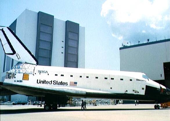 Discovery rolls into the Orbiter Processing Facility at NASA’s Kennedy Space Center in Florida 