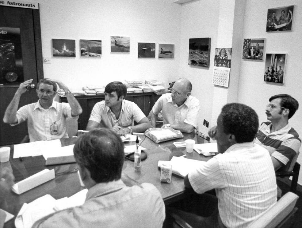 STS-8 crew debrief with the STS-9 crew