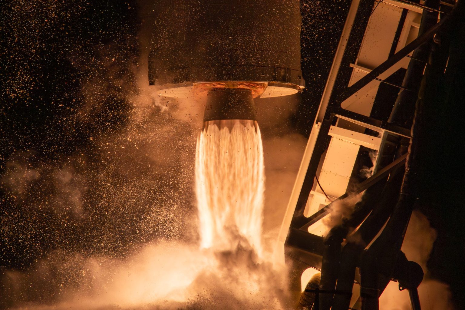 The bottom portion of the Antares rocket showing the flames from the engines during liftoff.