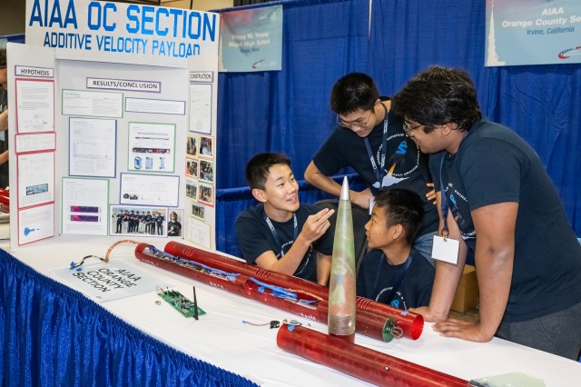 Students from the AIAA Orange Country Section team of Irvine, California, display their rocket to news media and the public during Rocket Fair – an annual showcase event of NASA’s Student Launch competition April 2023.