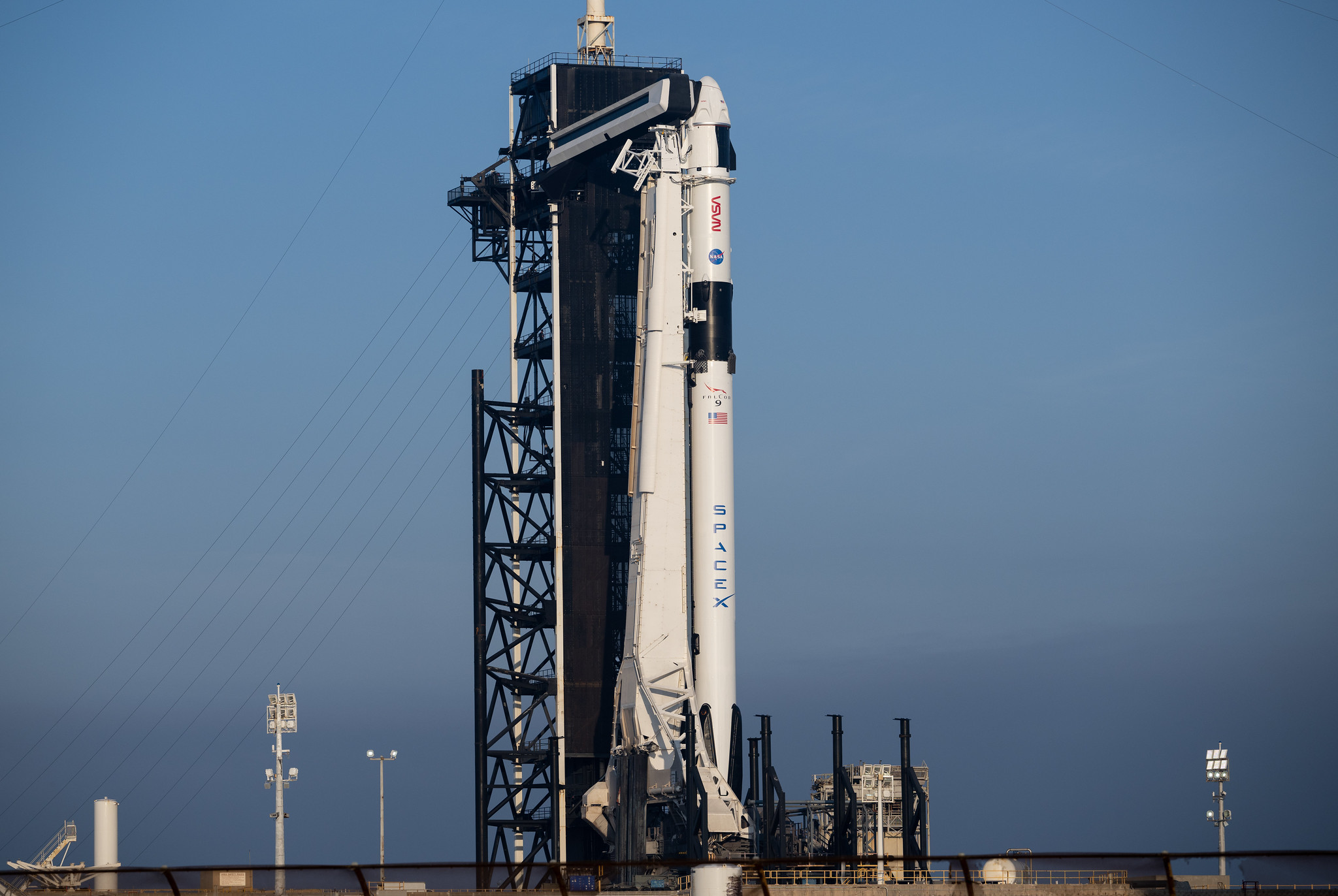 A SpaceX Falcon 9 rocket with the company's Dragon spacecraft on top is seen on the launch pad