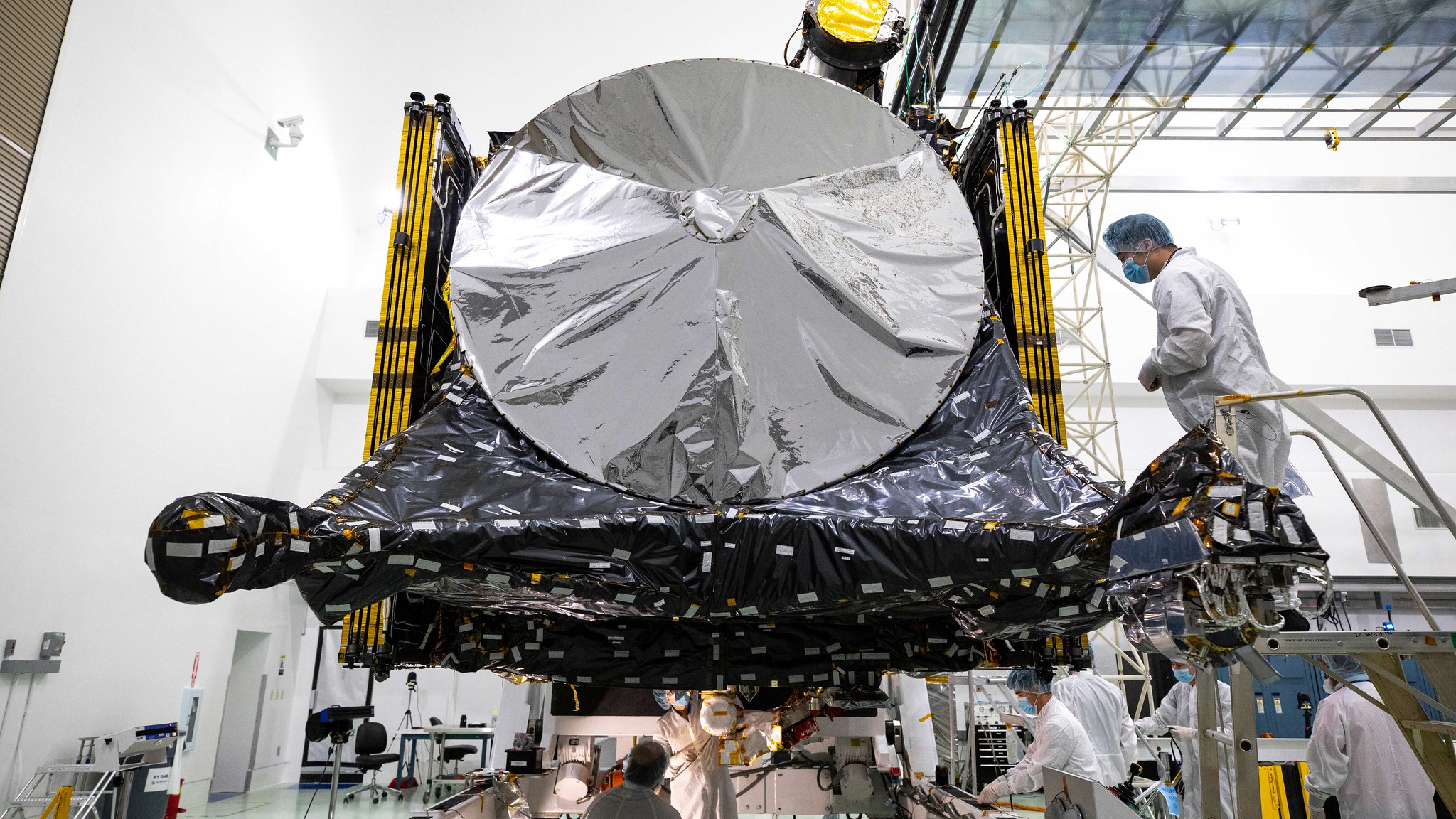 Here, Psyche mission team members prepare the spacecraft at a facility near NASA’s Kennedy Space Center in Florida in late July, just after the solar arrays were folded and stowed.