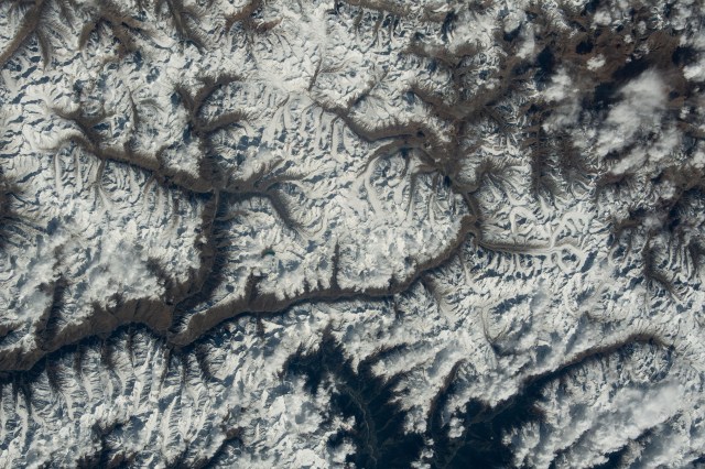 iss070e005963 (Oct. 19, 2023) -- Bordering Pakistan, China, and India, the Karakoram mountain range displays its snow-capped peaks. The mountain range ranks as the second-highest on Earth and is the most glaciated area on our home planet outside of the polar regions. As the International Space Station orbited 260 miles above, ESA (European Space Agency) astronaut Andreas Mogensen captured this image.