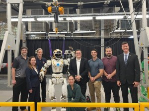 NASA’s Dexterous Robotics Team and U.S. State Department representatives with NASA’s Valkyrie robot at Woodside Energy. From left: Mark Paterson (METECS), Siri Nair (US Consul General), Scott Askew (NASA), Valkyrie, Clare Millen (US Consul General Economic Advisor), Evan Laske (NASA), Alex Sowell (NASA), Misha Savchenko (METECS), Oliver Bentley (US Department of Commerce). Credits: NASA