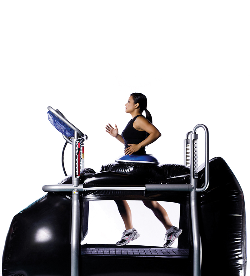 Woman running on the anti-gravity treadmill.