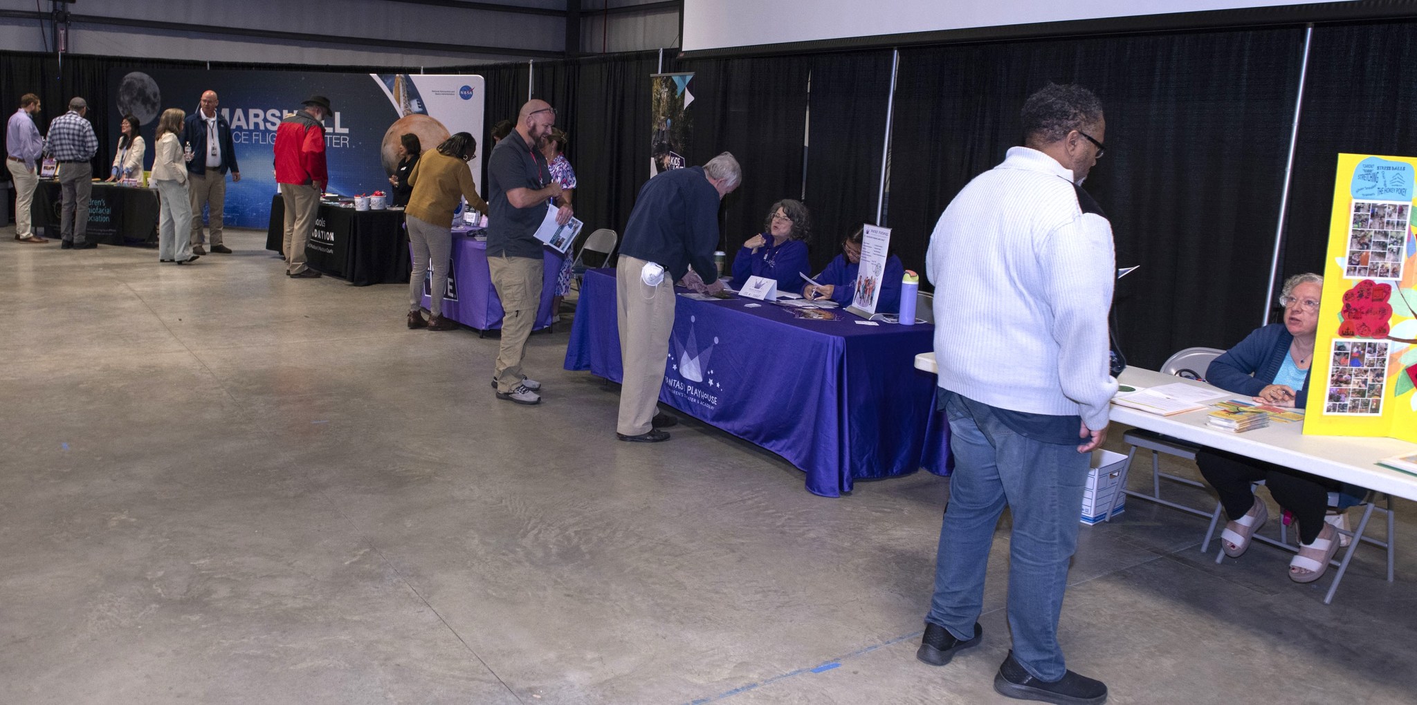 Marshall team members visit some of the different charities represented at the CFC kickoff event.