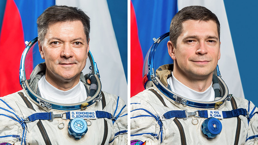 Flight Engineers Oleg Kononenko (left) and Nikolai Chub (right) of Roscosmos are pictured in the Orlan spacesuits they will wear during a seven-hour spacewalk.