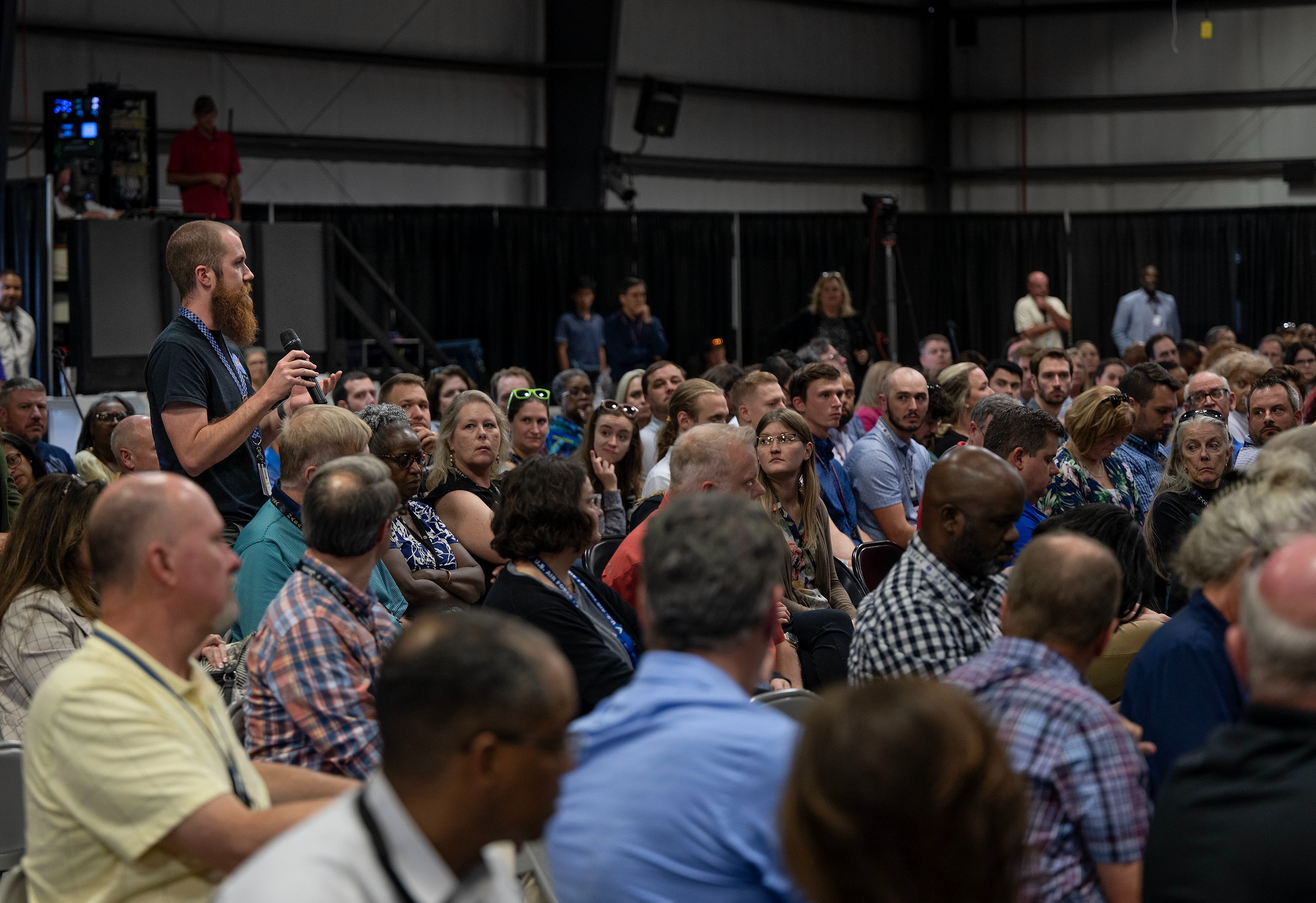 A Marshall team member poses a question to agency leaders during the Q&A portion of the Town Hall.