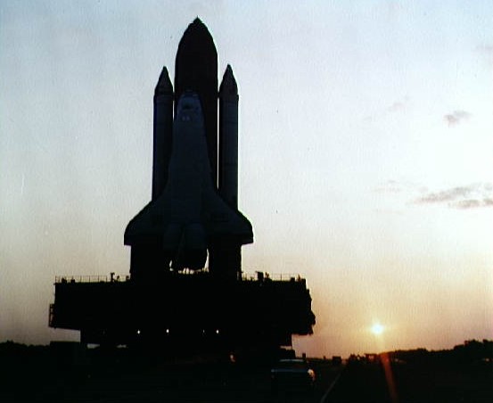 Space shuttle Discovery begins its rollout from the VAB to Launch Pad 39A.