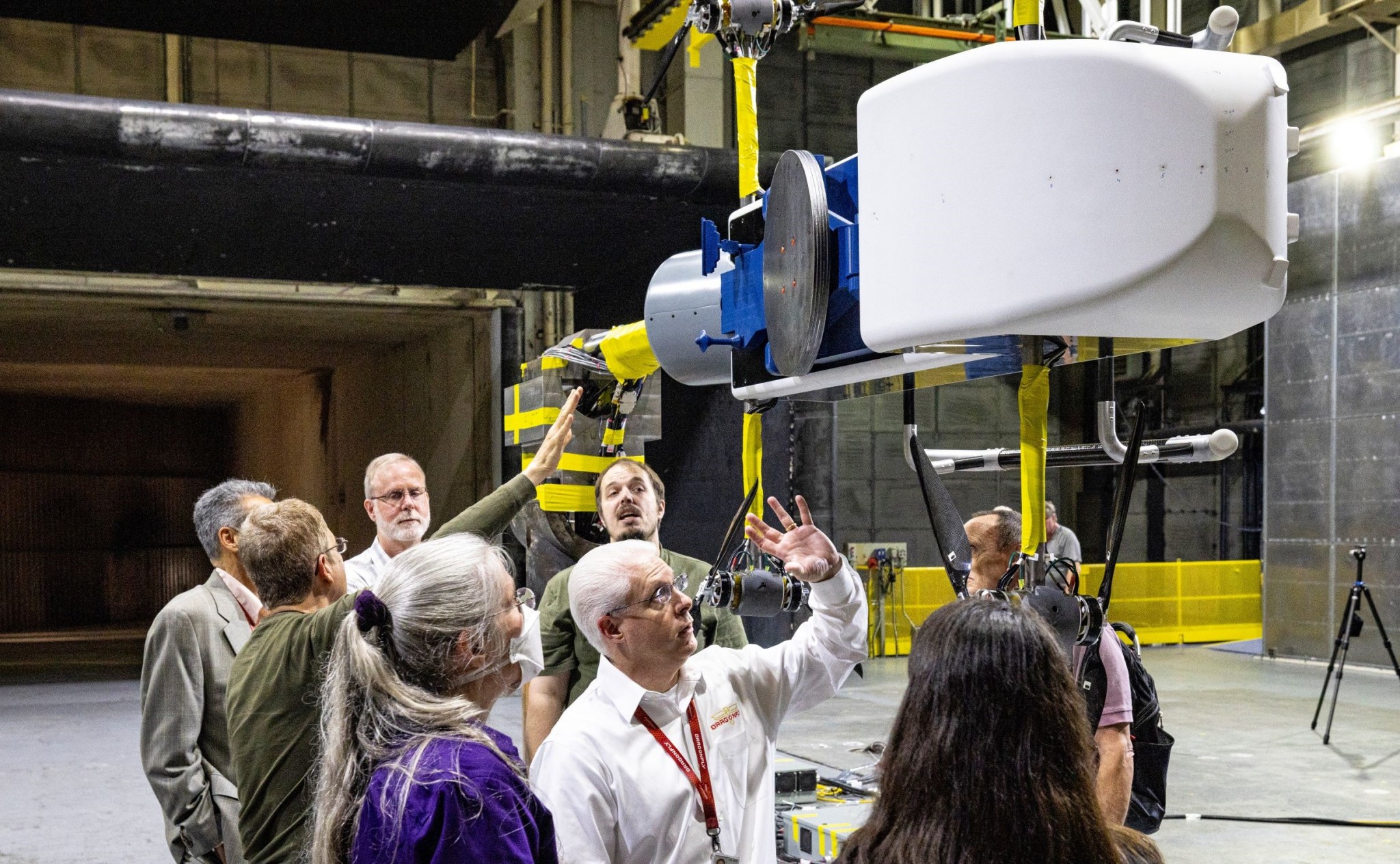 Dragonfly team members review the half-scale lander model