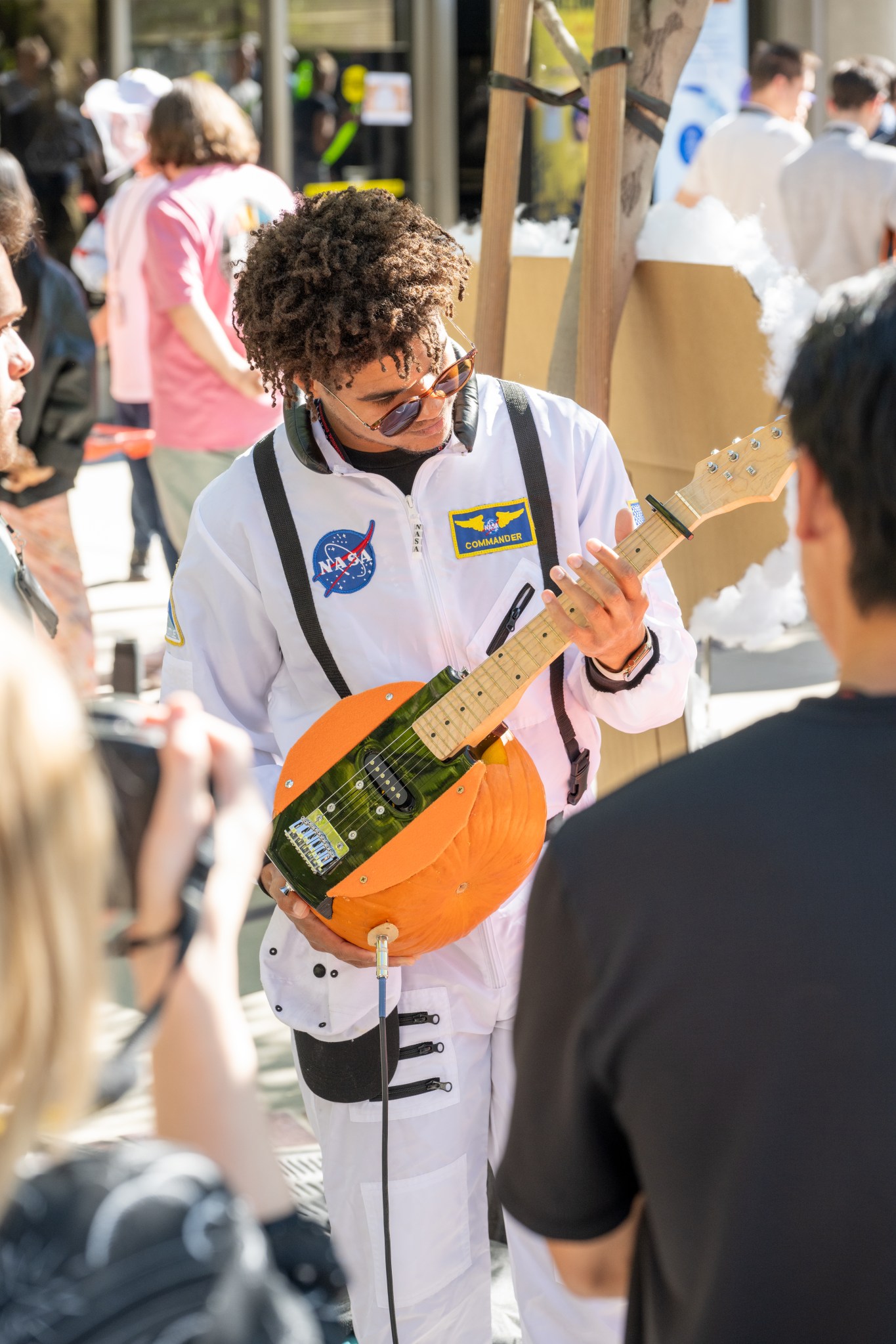 JPL employee with a pumpkin carved guitar