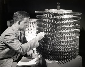 Man pointing to multi-stage compressor.