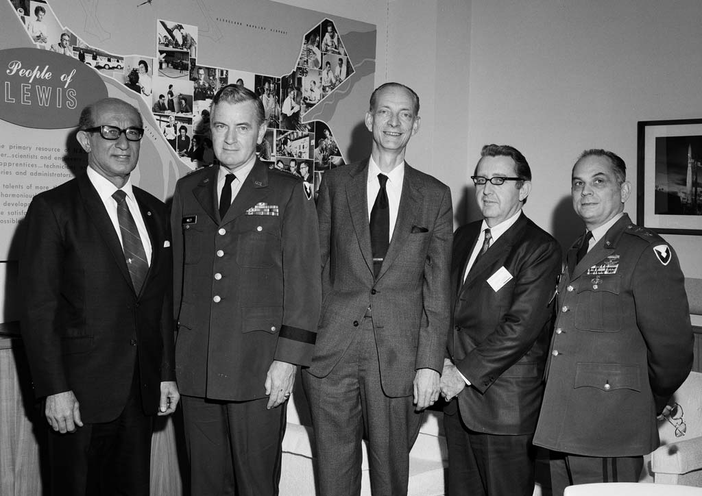 Group of men standing.