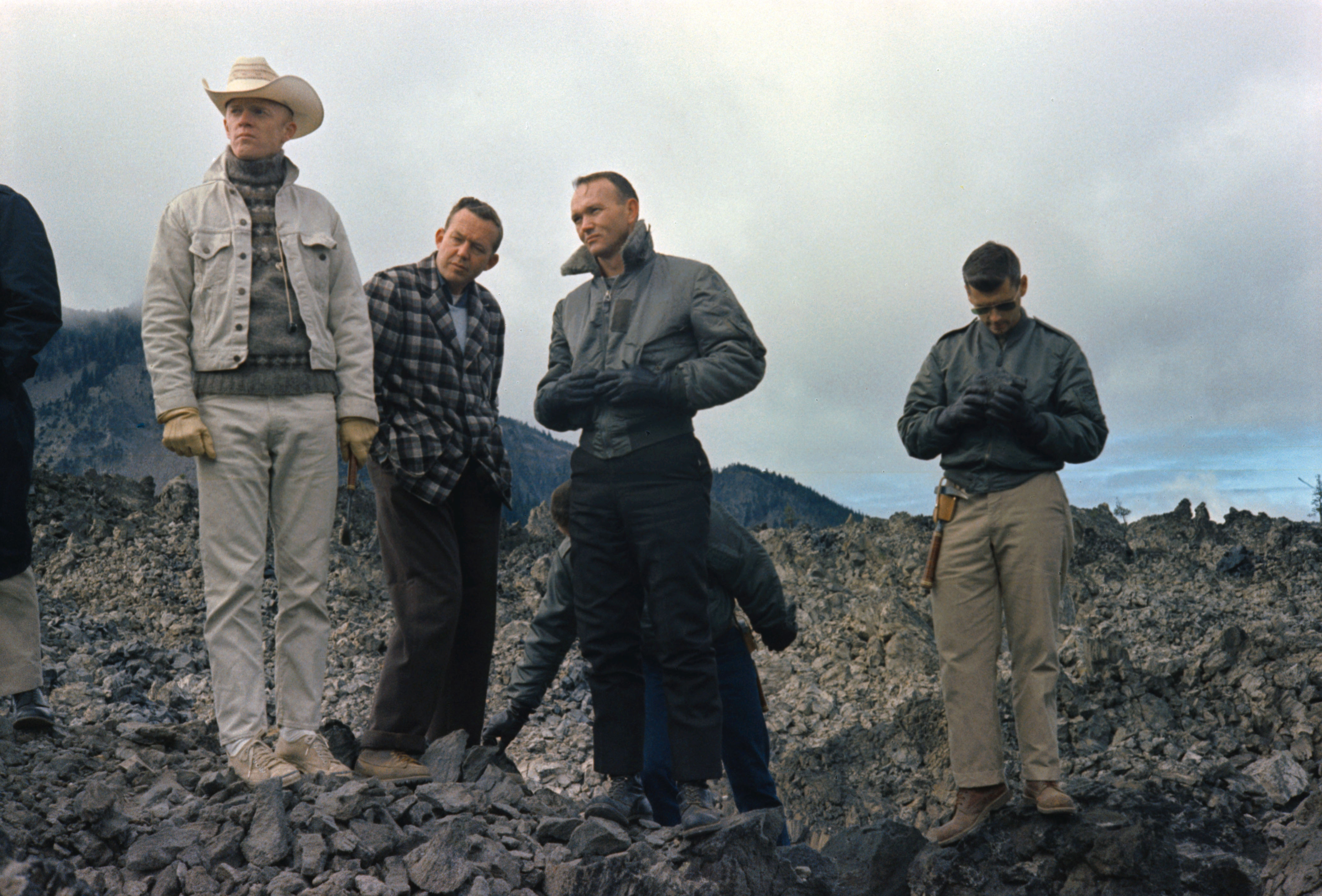 Schweickart, geologist Uel Clanton, Michael Collins, and Roger B. Chaffee during geology training near Bend, Oregon.