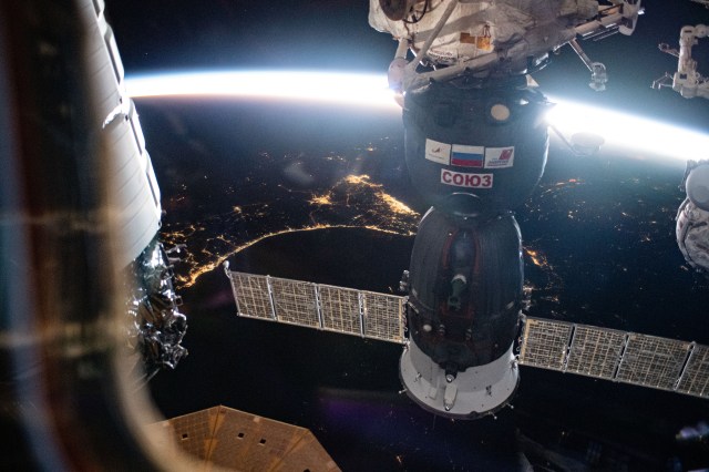 The Soyuz MS-24 crew ship is featured prominently in this photograph from the International Space Station as it soared into an orbital sunrise 259 miles above the Iran-Pakistan border. The city lights below highlight the United Arab Emirates on the Persian Gulf and Oman on the Gulf of Oman.