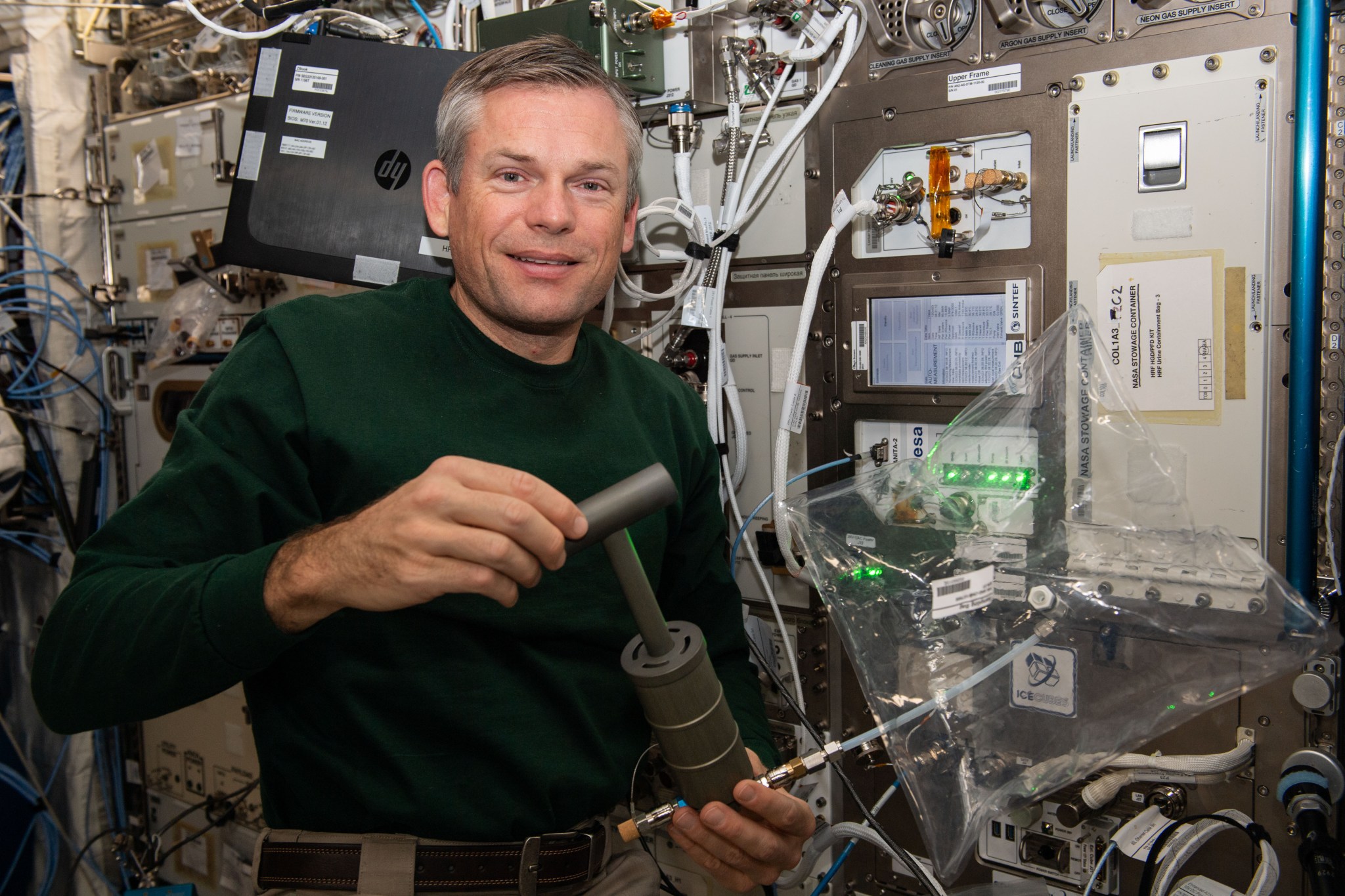 Expedition 70 Commander Andreas Mogensen of ESA (European Space Agency) demonstrates collecting air samples to analyze and quantify trace contaminants in the International Space Station's atmosphere. The Analyzing Interferometer for Ambient Air-2, or ANITA-2, serves as a technology demonstration in support of human exploration missions beyond low-Earth orbit.