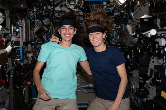 (From left) Expedition 70 Flight Engineers Jasmin Moghbeli and Loral O'Hara, both from NASA, wear Bio-Monitor headbands packed with sensors that monitor an astronaut's health and physiological parameters while minimally interfering with their crew activities.