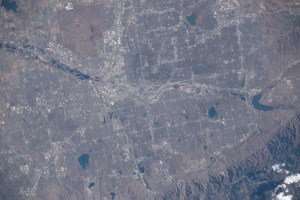Denver, Colorado, split by the South Platte River and next to the Rocky Mountains, is pictured from the International Space Station as it orbited 262 miles above the Centennial State.