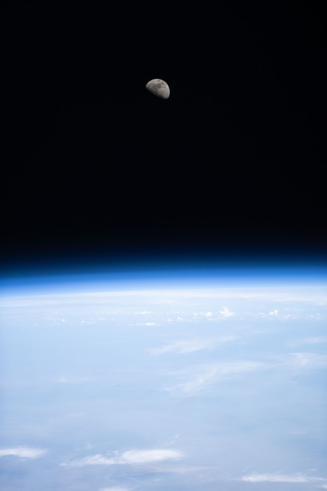 The first quarter Moon is pictured above Earth's horizon from the International Space Station as it orbited 260 miles above the African nation of Niger.
