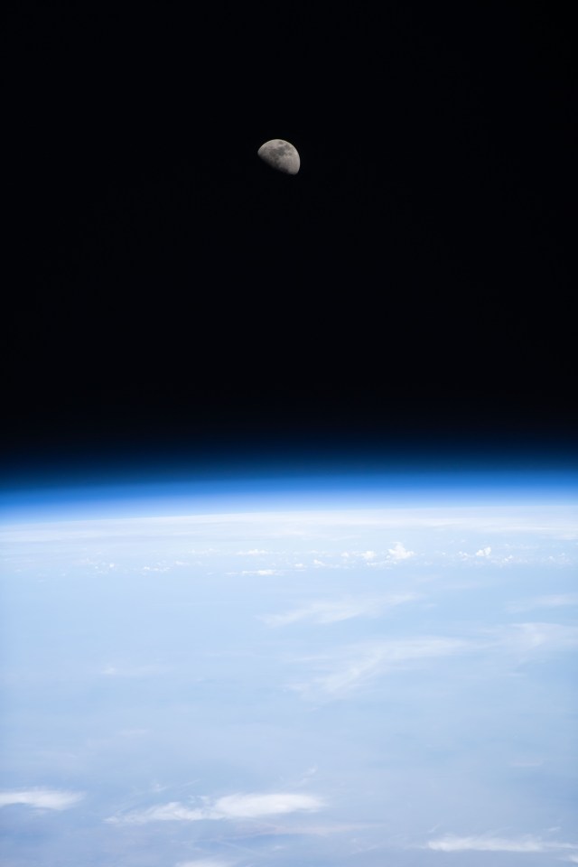 The first quarter Moon is pictured above Earth's horizon from the International Space Station as it orbited 260 miles above the African nation of Niger.