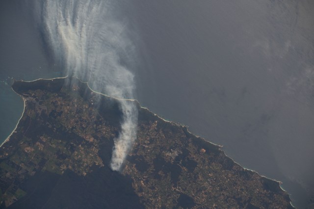 A wildfire in Western Australia's Forest Grove National Park, with smoke billowing out into the Indian Ocean, is pictured from the International Space Station as it orbited 266 miles above.