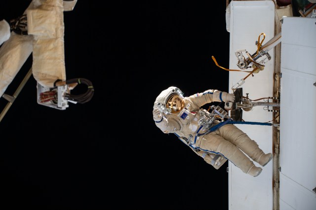 Expedition 70 Flight Engineer Nikolai Chub from Roscosmos is pictured during a spacewalk to inspect a backup radiator, deploy a nanosatellite, and install communications hardware on the International Space Station's Nauka science module.