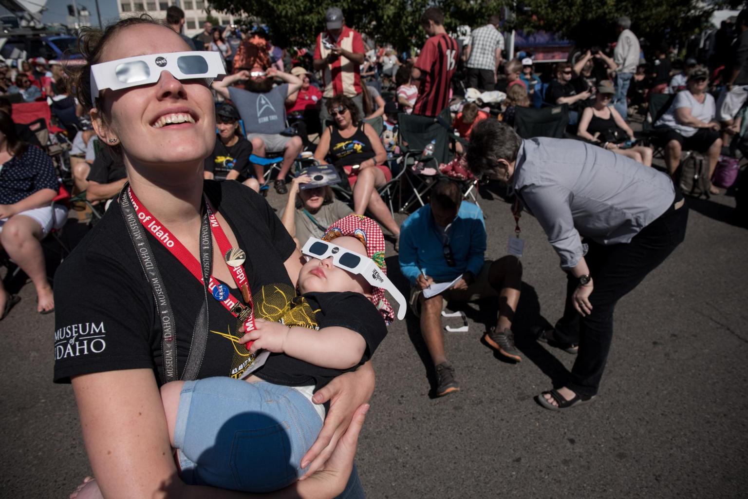 Juniper Doucette with her mother Chloe Doucette, head of education at the museum of Idaho Falls, celebrate the 2017 total solar eclipse.