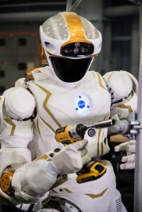 Valkyrie is photographed with a drill to demonstrate the humanoid robot's dexterity and how it can assist with tasks. Credits: NASA