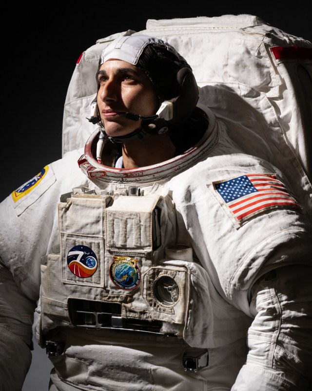 Official portrait of NASA astronaut Jasmin Moghbeli in a spacesuit.