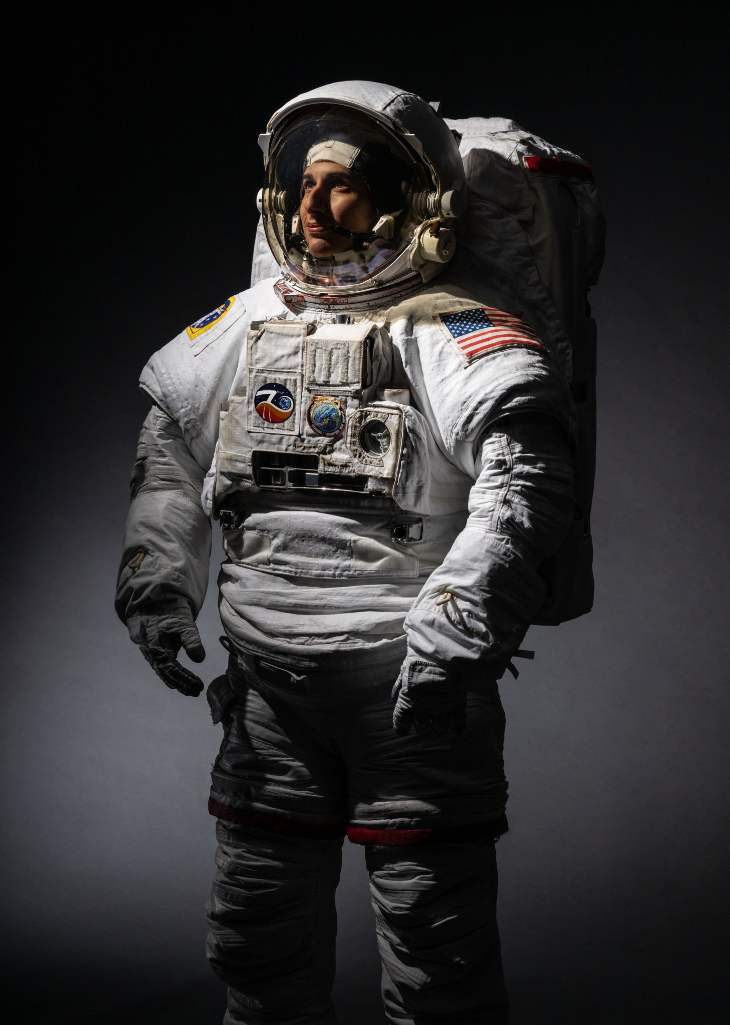 Official portrait of NASA astronaut Jasmin Moghbeli in a spacesuit.