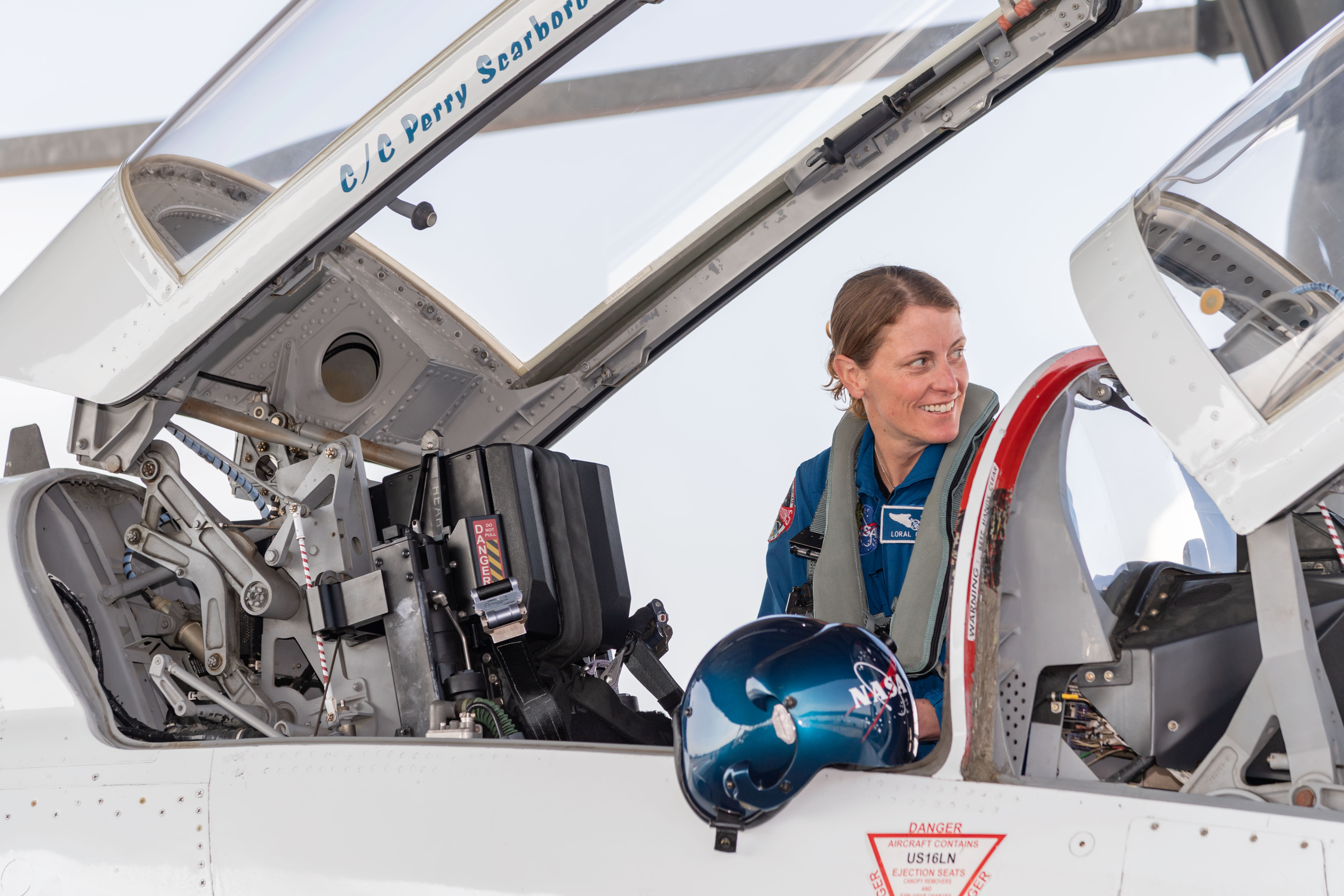 Astronaut Loral O’Hara boards a T-38 trainer jet