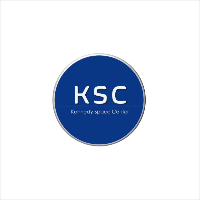 a blue circle with a silver outline with the initials K S C in the middle